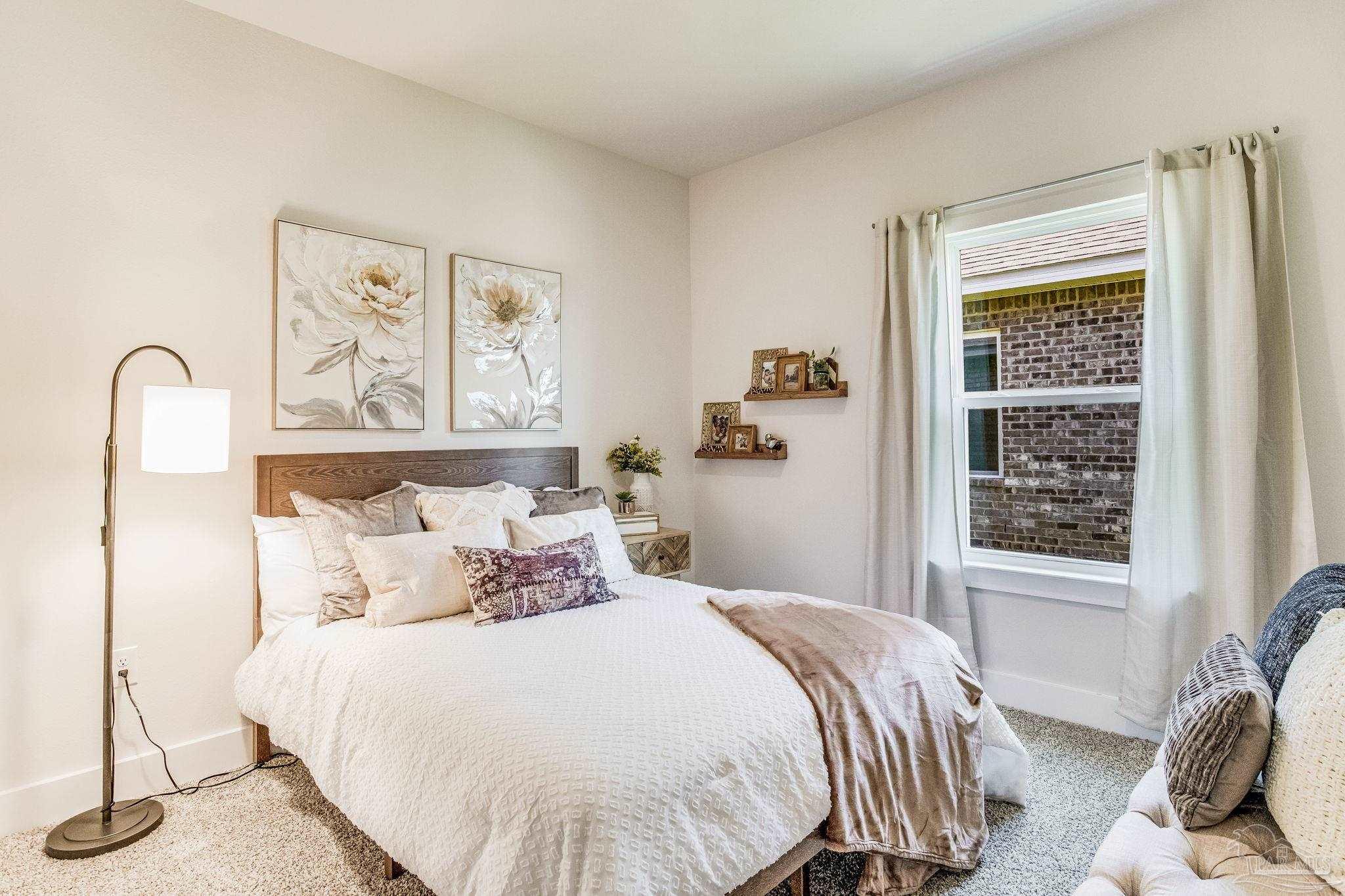 9793 Windy Hill Road Pensacola, FL 32526 - Photo 18 of 36 a bedroom with a bed and a window