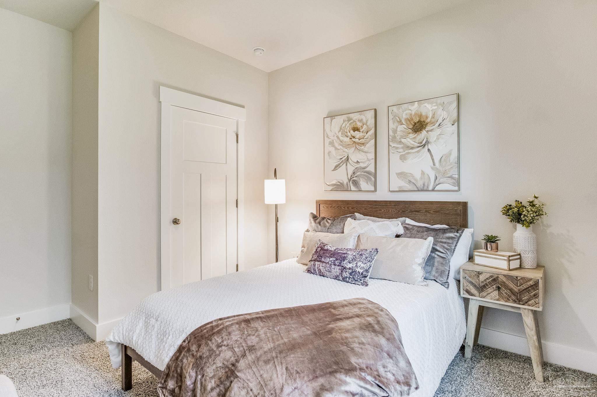 9793 Windy Hill Road Pensacola, FL 32526 - Photo 19 of 36 a bedroom with a bed and a painting on the wall