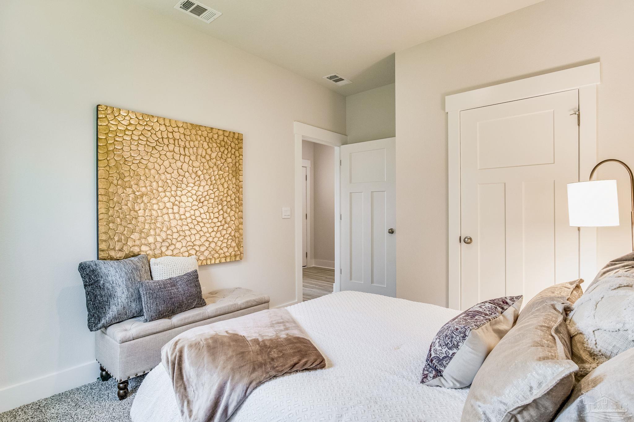 9793 Windy Hill Road Pensacola, FL 32526 - Photo 20 of 36 a bedroom with a bed and a window