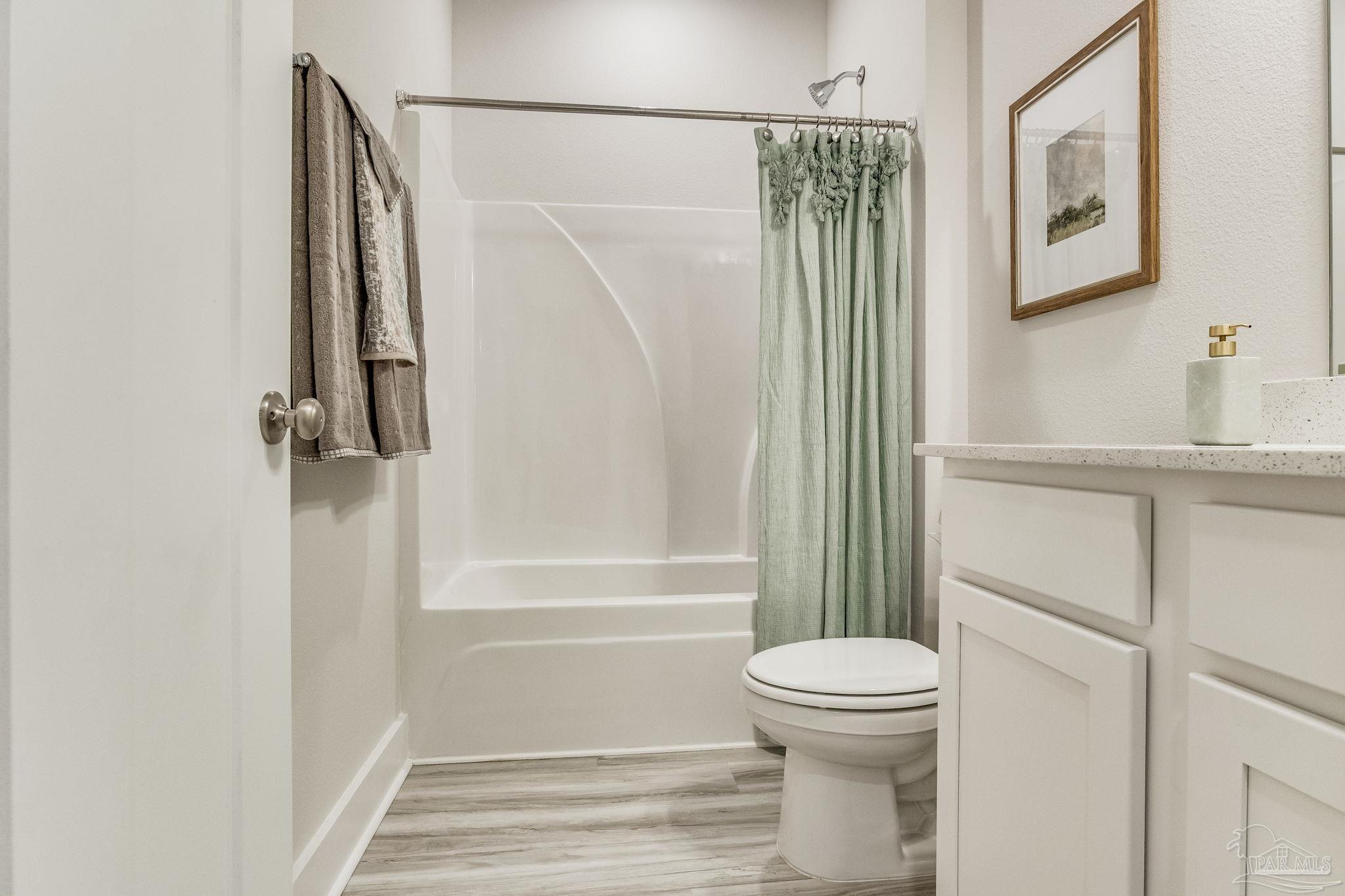 9793 Windy Hill Road Pensacola, FL 32526 - Photo 22 of 36 a bathroom with a toilet and a shower