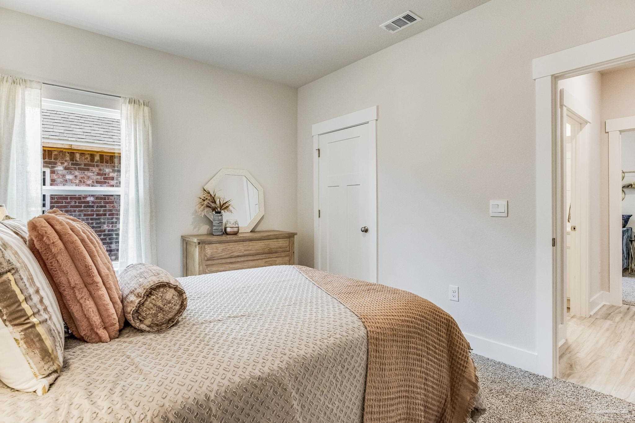 9793 Windy Hill Road Pensacola, FL 32526 - Photo 24 of 36 a bedroom with a bed and window