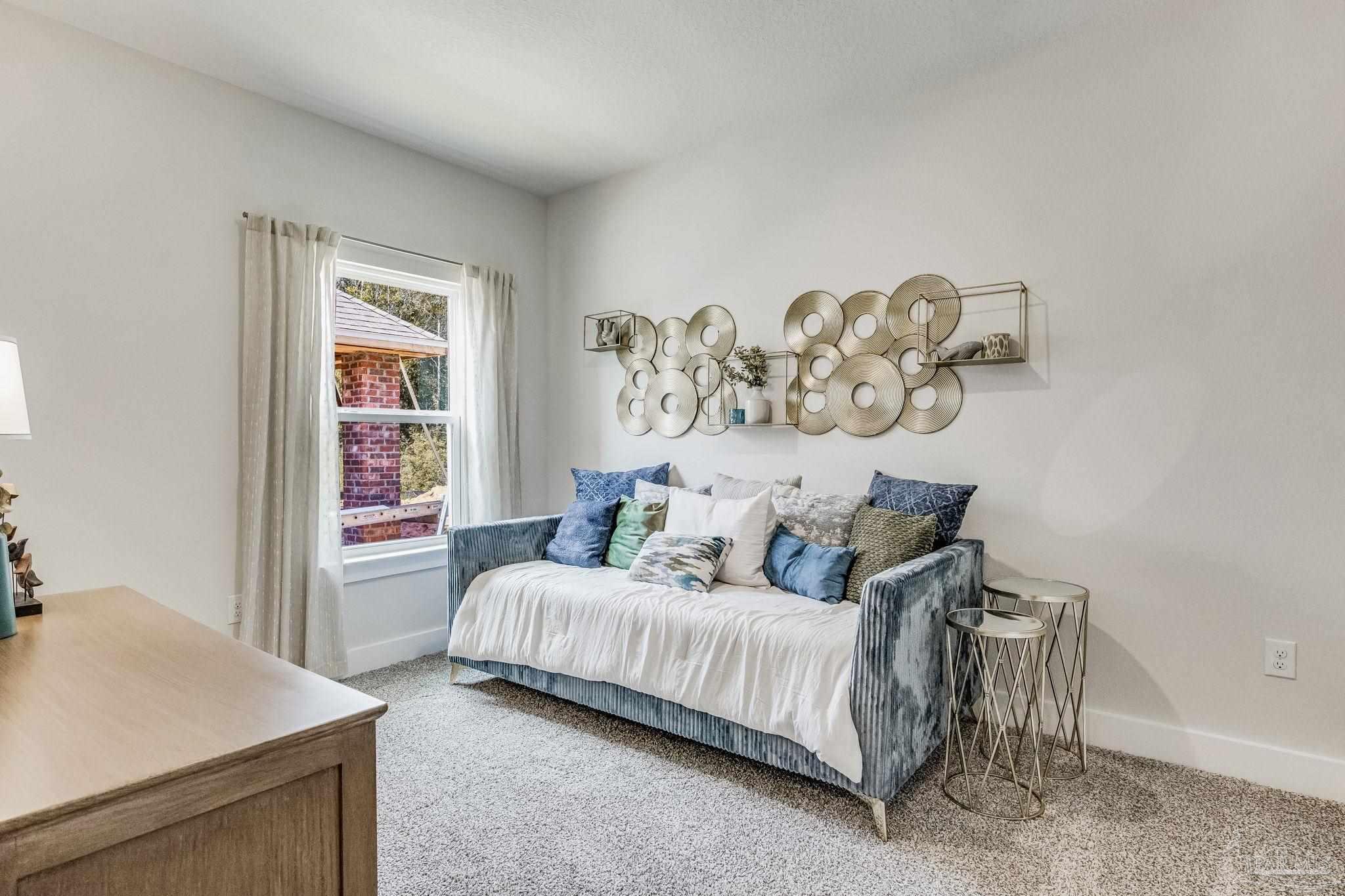 9793 Windy Hill Road Pensacola, FL 32526 - Photo 26 of 36 a bedroom with a bed and a window