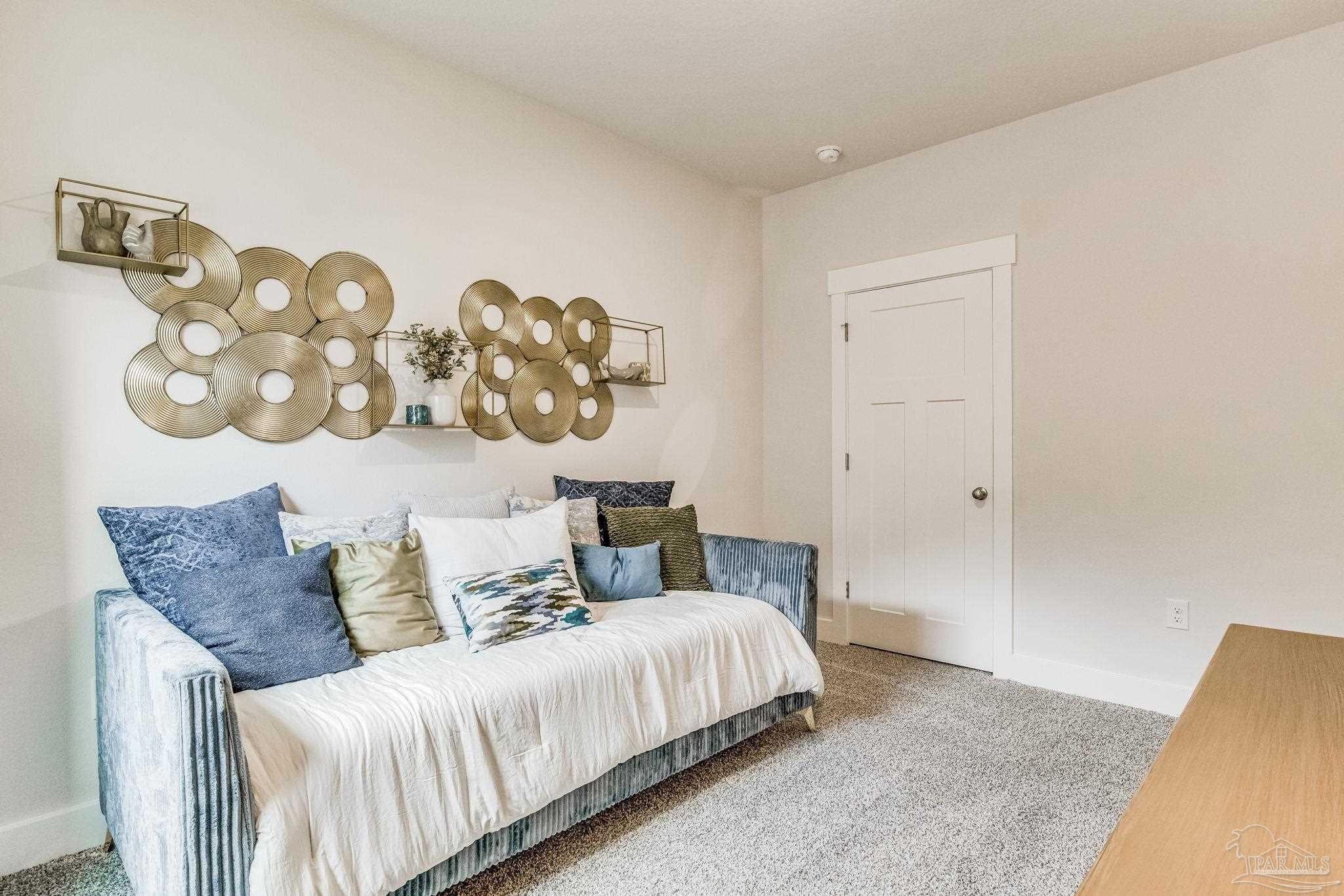 9793 Windy Hill Road Pensacola, FL 32526 - Photo 27 of 36 a bedroom with a bed and flowerpot