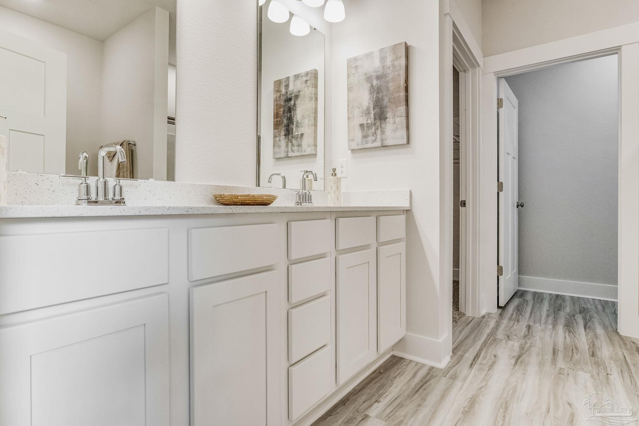 9793 Windy Hill Road Pensacola, FL 32526 - Photo 31 of 36 a bathroom with a sink and mirror