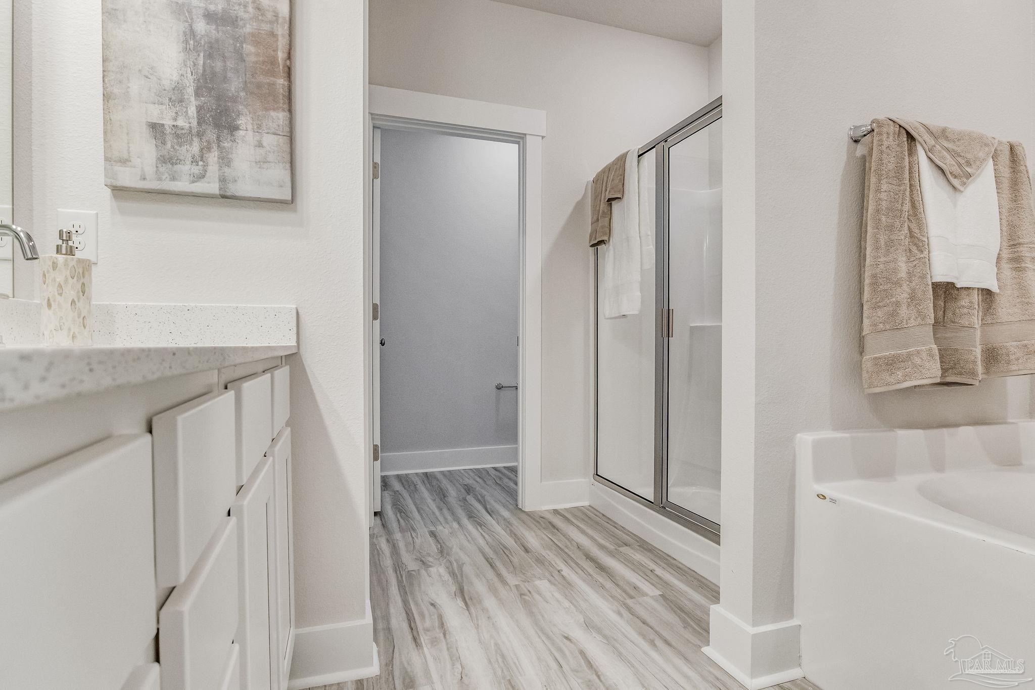 9793 Windy Hill Road Pensacola, FL 32526 - Photo 32 of 36 a bathroom with a sink and a mirror