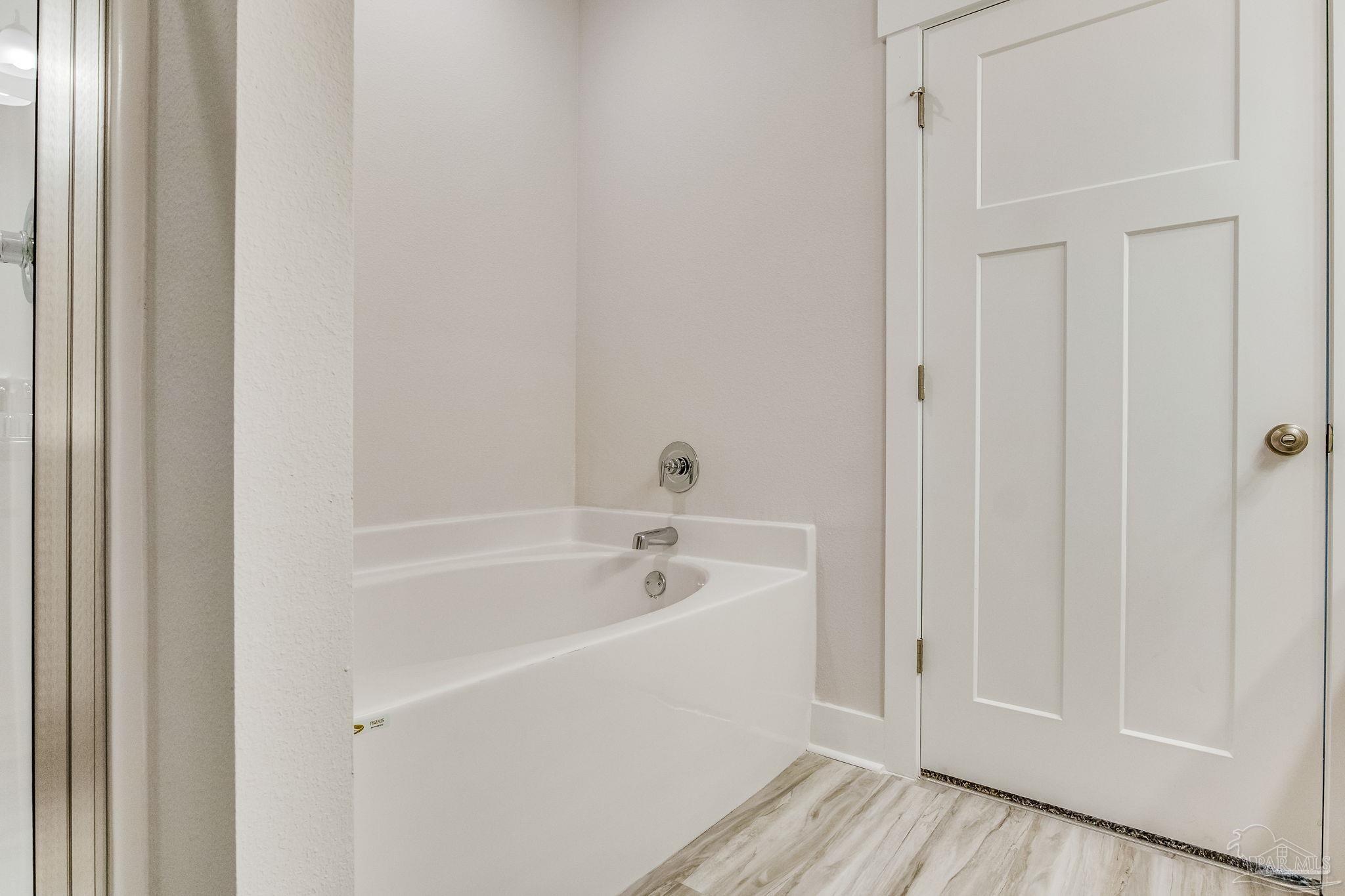 9793 Windy Hill Road Pensacola, FL 32526 - Photo 35 of 36 a white bath tub sitting next to a white sink