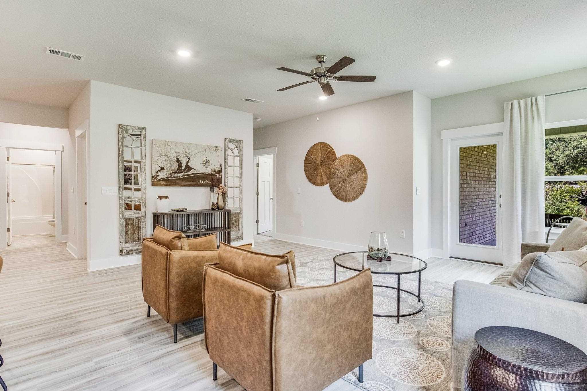 9793 Windy Hill Road Pensacola, FL 32526 - Photo 8 of 36 a living room with furniture and a large window