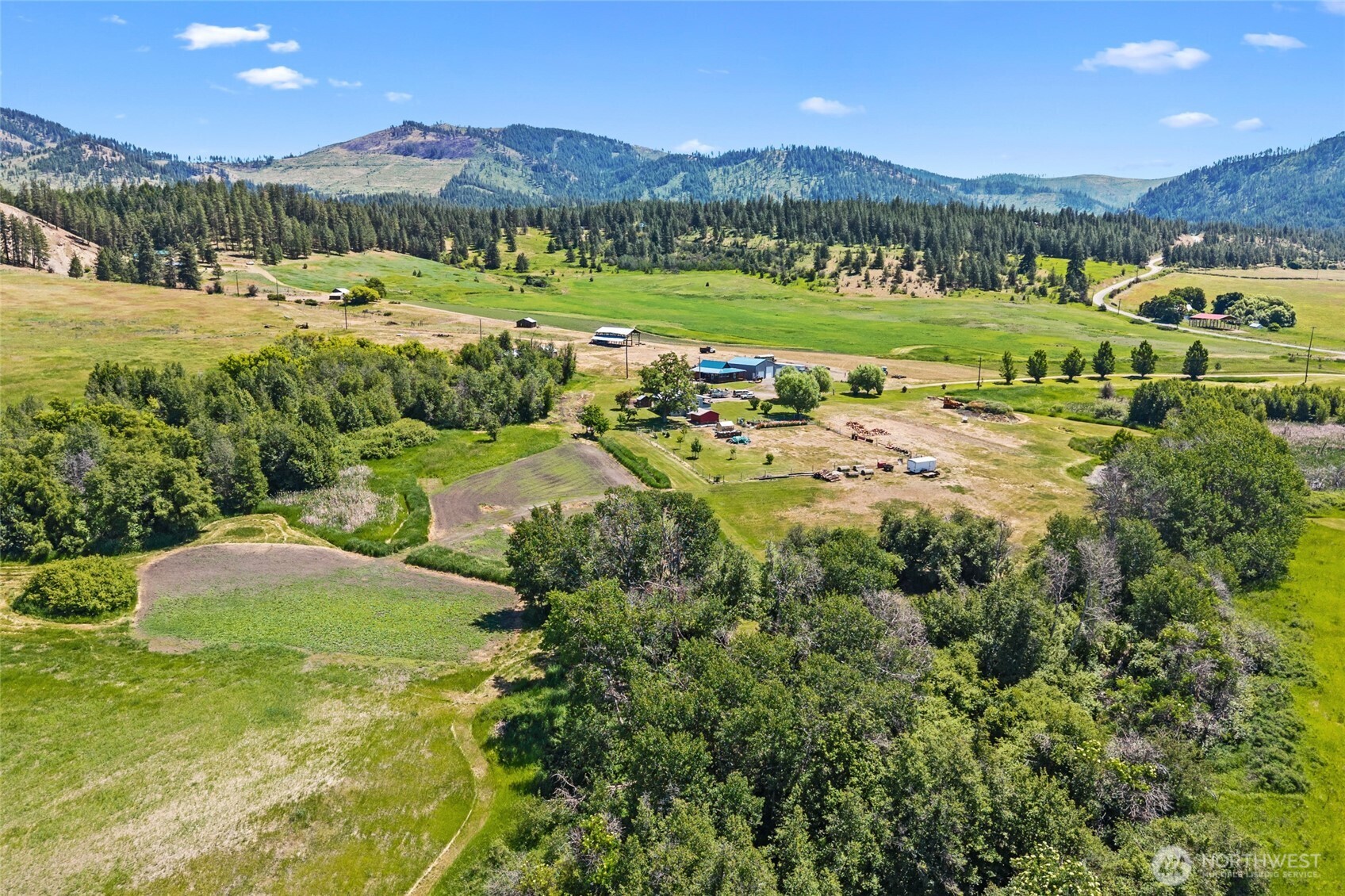 5787 Fruitland Valley Road Fruitland, WA 99129 - Photo 4 of 29 a view of a lush green hillside and houses