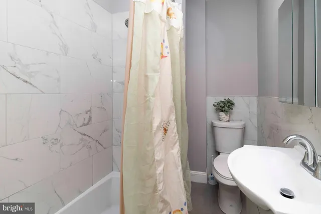 a bathroom with a sink and toilet