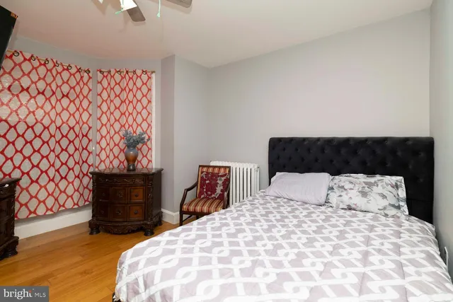 a bedroom with a bed and chair