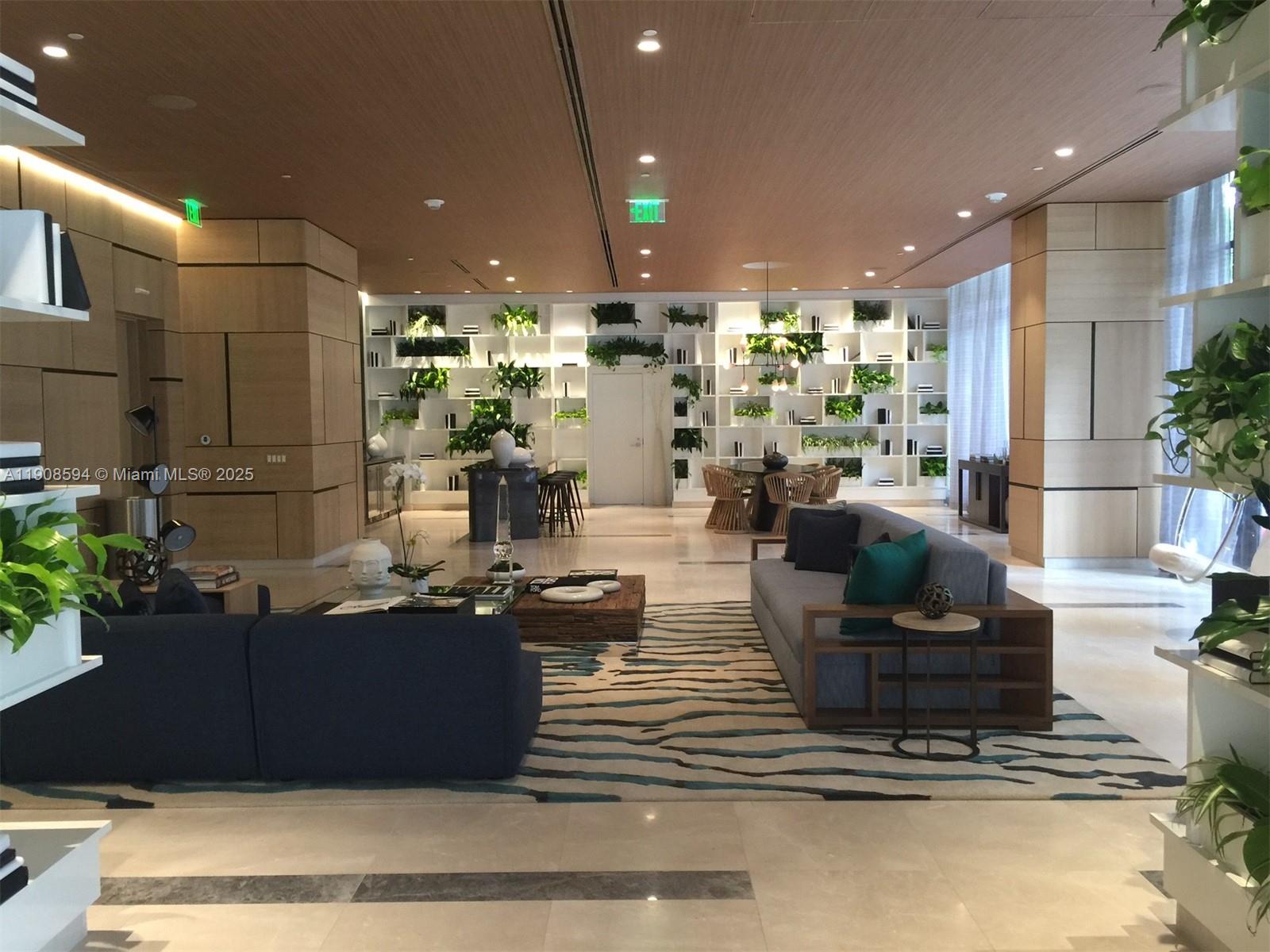 45 Southwest 9th Street, Unit 1402 Miami, FL 33130 - Photo 14 of 19 a living room with couches and kitchen view