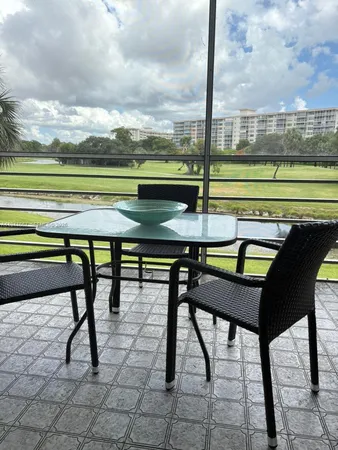 a view of a chairs and table on the terrace