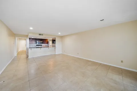a view of kitchen with refrigerator and kitchen stove