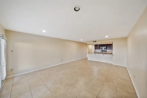 a view of a livingroom with kitchen