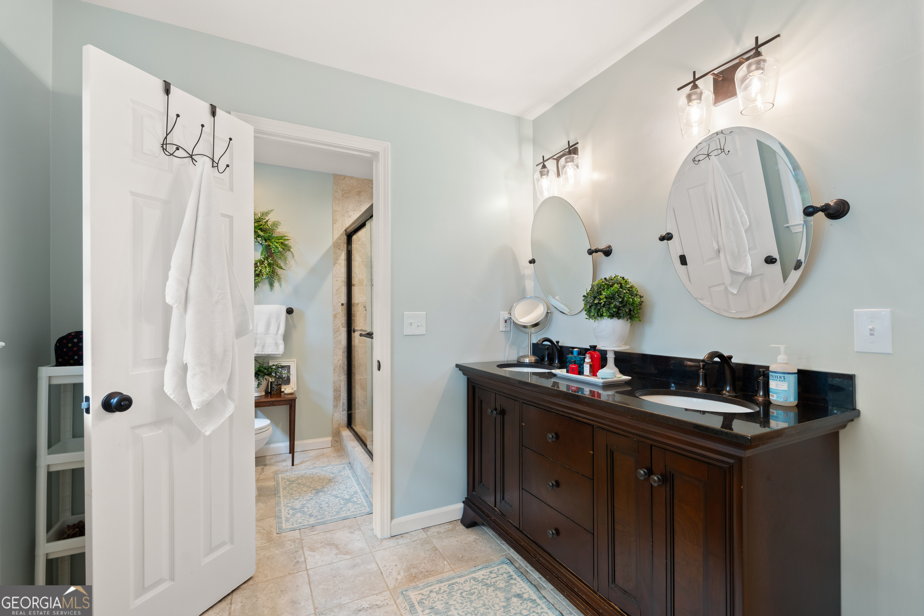 836 Oak Grove Road Carrollton, GA 30117 - Photo 34 of 50 a bathroom with a double vanity sink mirror and shower