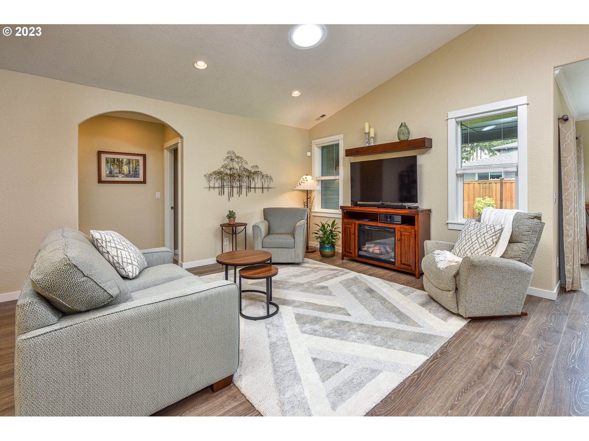 878 Tyson Lane Eugene, OR 97404 - Photo 16 of 39 a living room with furniture and a flat screen tv