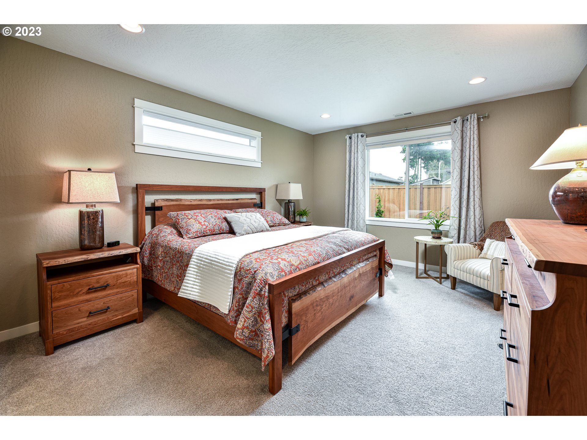 878 Tyson Lane Eugene, OR 97404 - Photo 17 of 39 a bedroom with a bed and a lamp