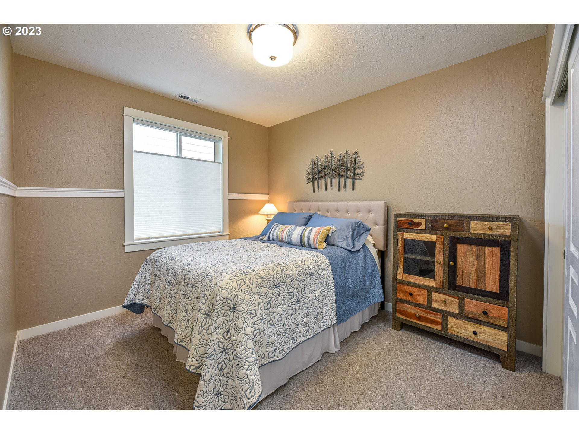 878 Tyson Lane Eugene, OR 97404 - Photo 25 of 39 a bedroom with a bed next to a window