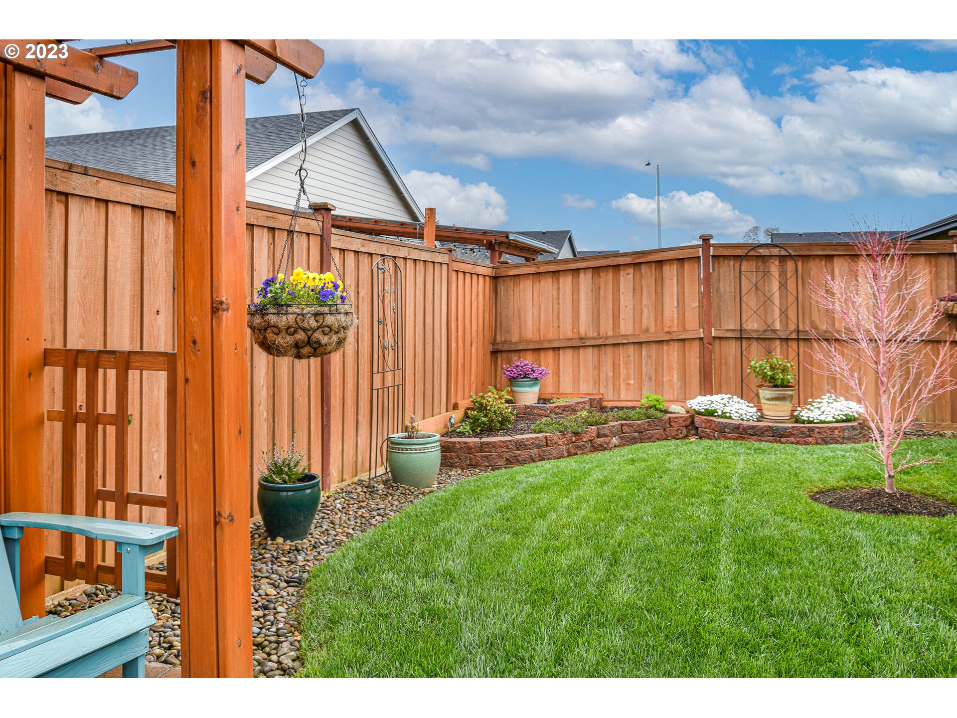 878 Tyson Lane Eugene, OR 97404 - Photo 33 of 39 a view of a backyard with plants and a garden