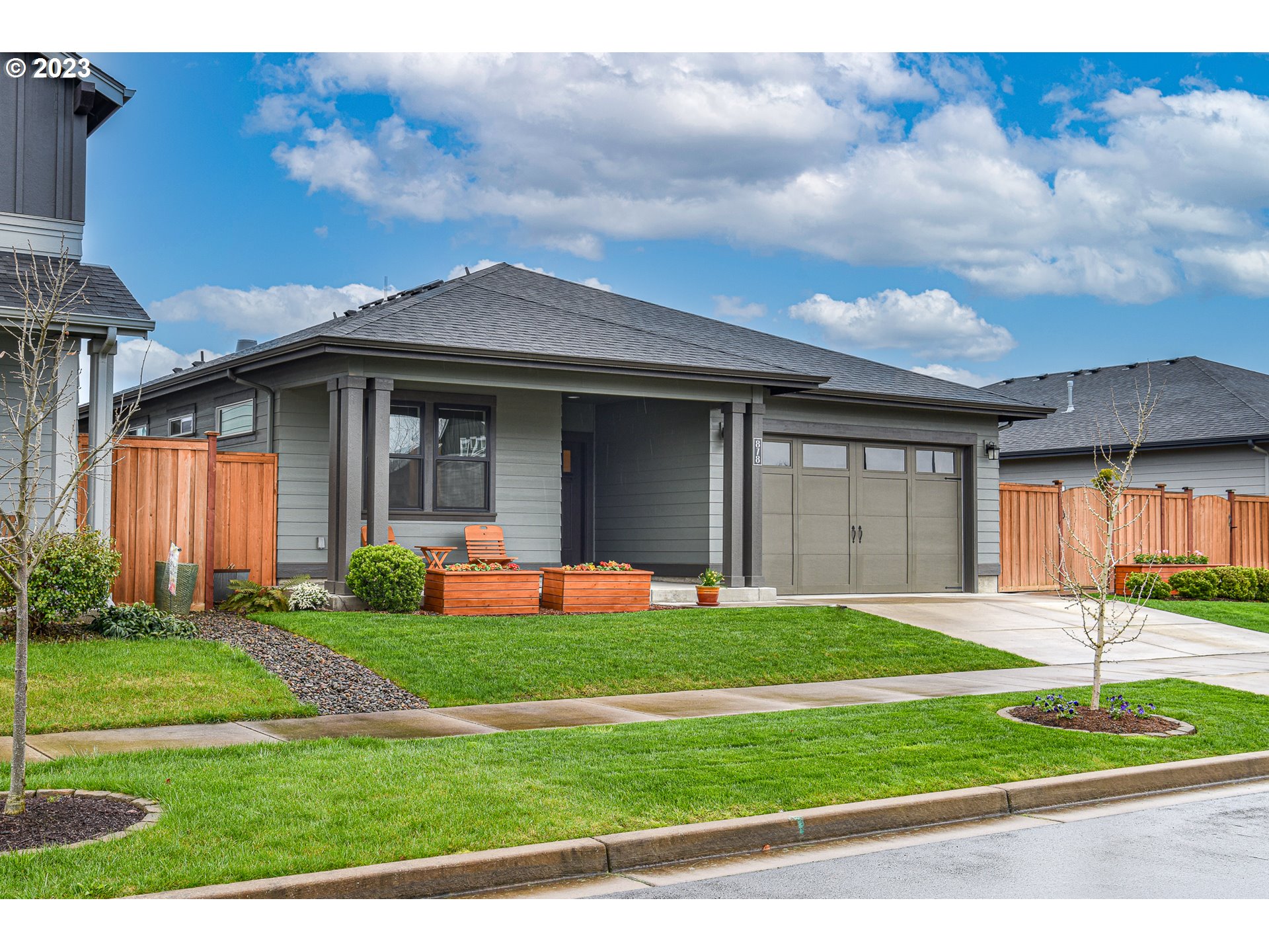 878 Tyson Lane Eugene, OR 97404 - Photo 39 of 39 a front view of a house with a yard and garage