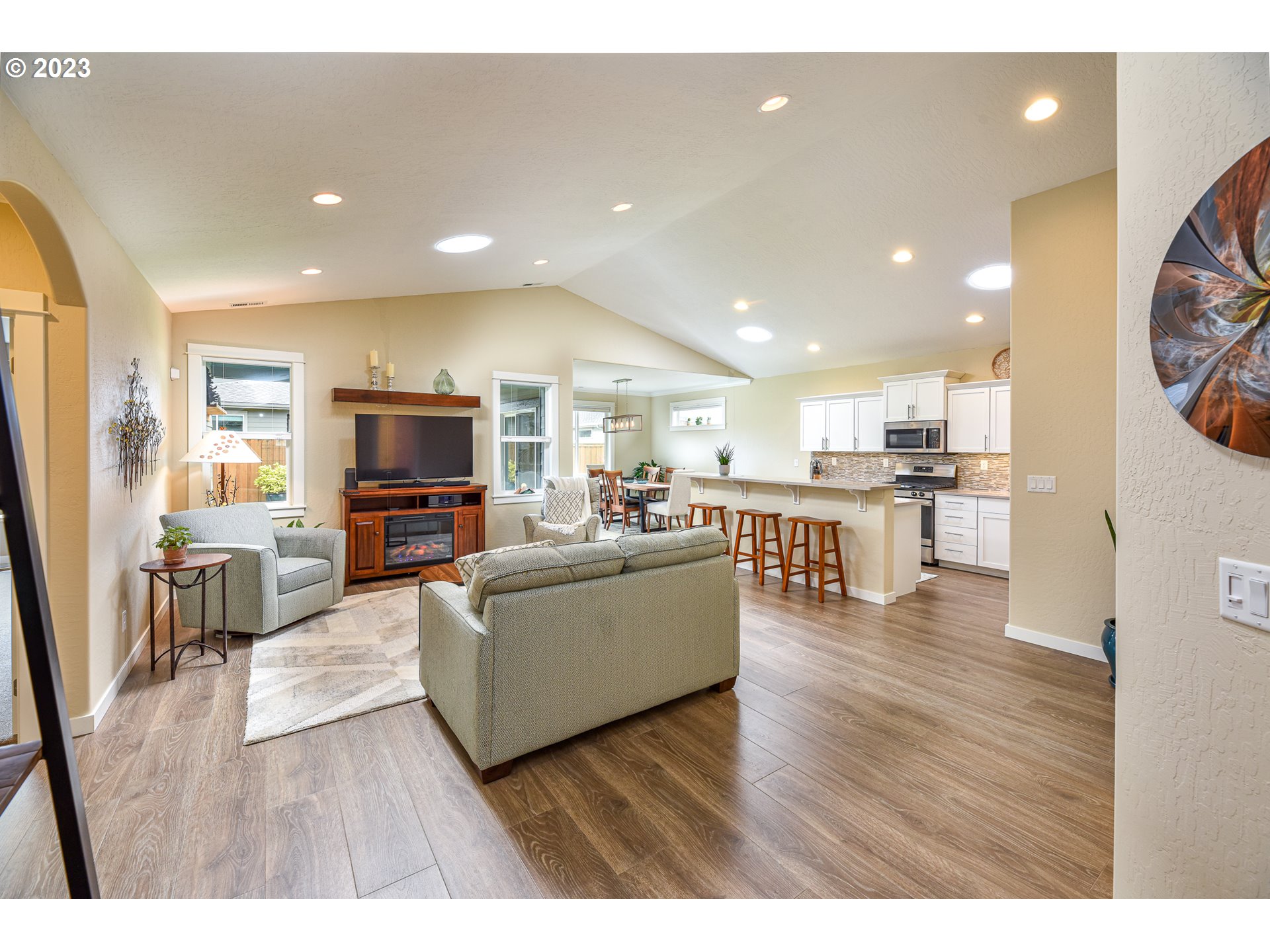 878 Tyson Lane Eugene, OR 97404 - Photo 6 of 39 a living room with furniture and a flat screen tv