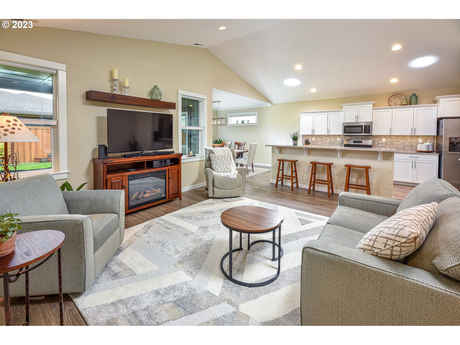 878 Tyson Lane Eugene, OR 97404 - Photo 7 of 39 a living room with furniture and a flat screen tv