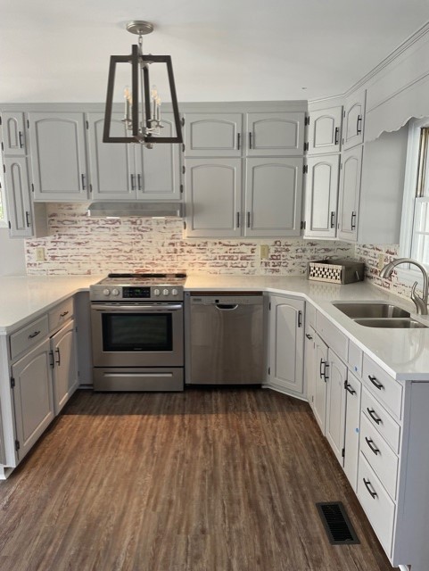 3125 Buffalo Road Lawrenceburg, TN 38464 - Photo 11 of 22 a kitchen with stainless steel appliances granite countertop a sink stove and cabinets