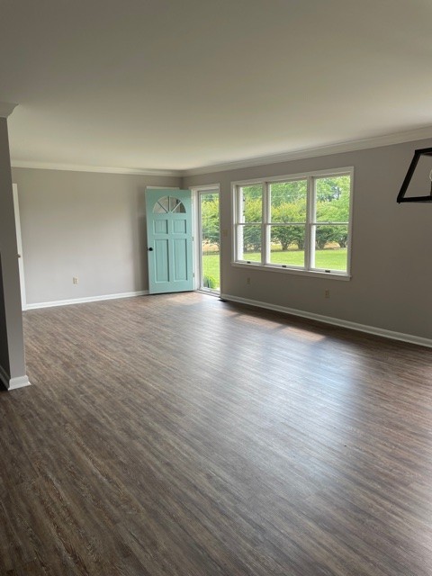 3125 Buffalo Road Lawrenceburg, TN 38464 - Photo 2 of 22 a view of an empty room with wooden floor and a window