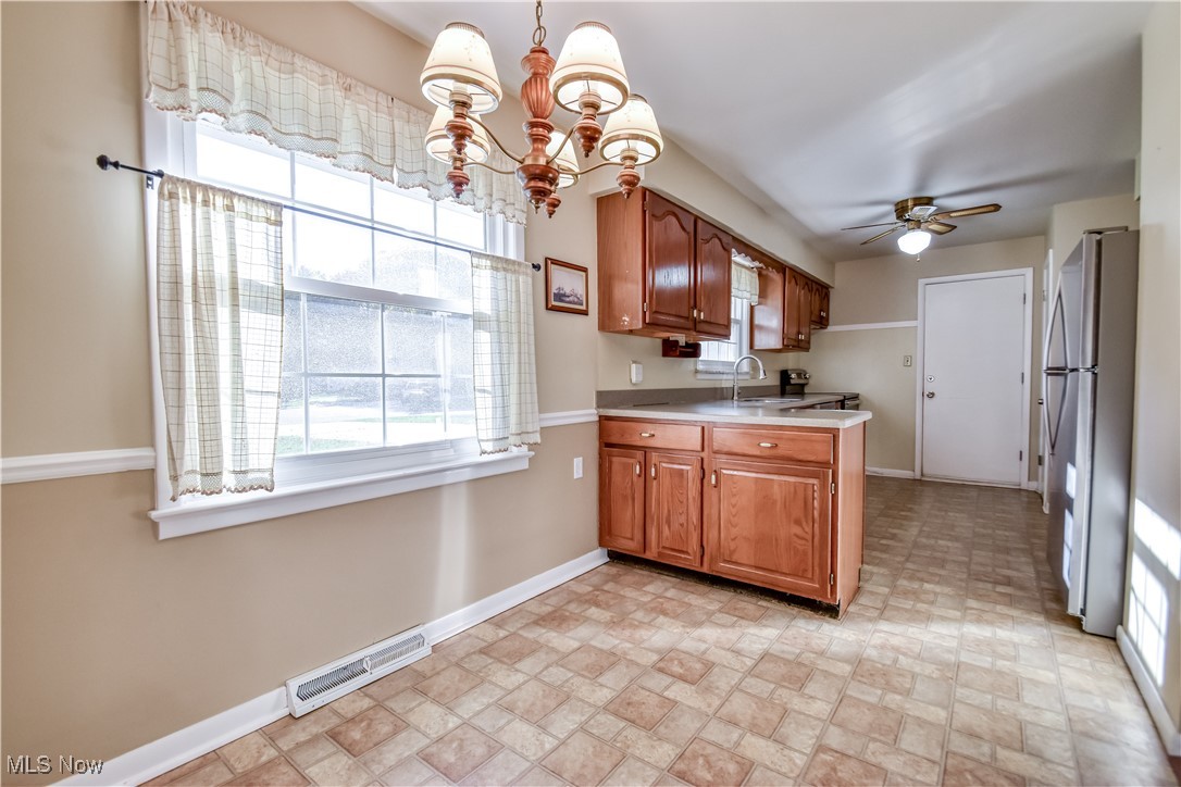 6145 Hemingway Road Cleveland, OH 44143 - Photo 6 of 50 Kitchen with healthy amount of natural light, hanging light fixtures, and a chandelier