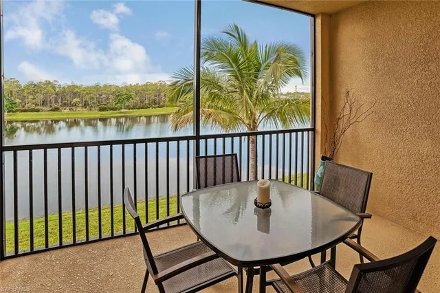 a view of a balcony with furniture and a potted plant