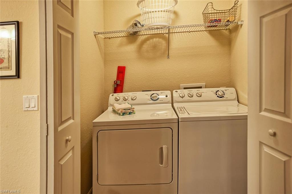 9727 Acqua Court, Unit 425 Naples, FL 34113 - Photo 15 of 26 a utility room with dryer and washer