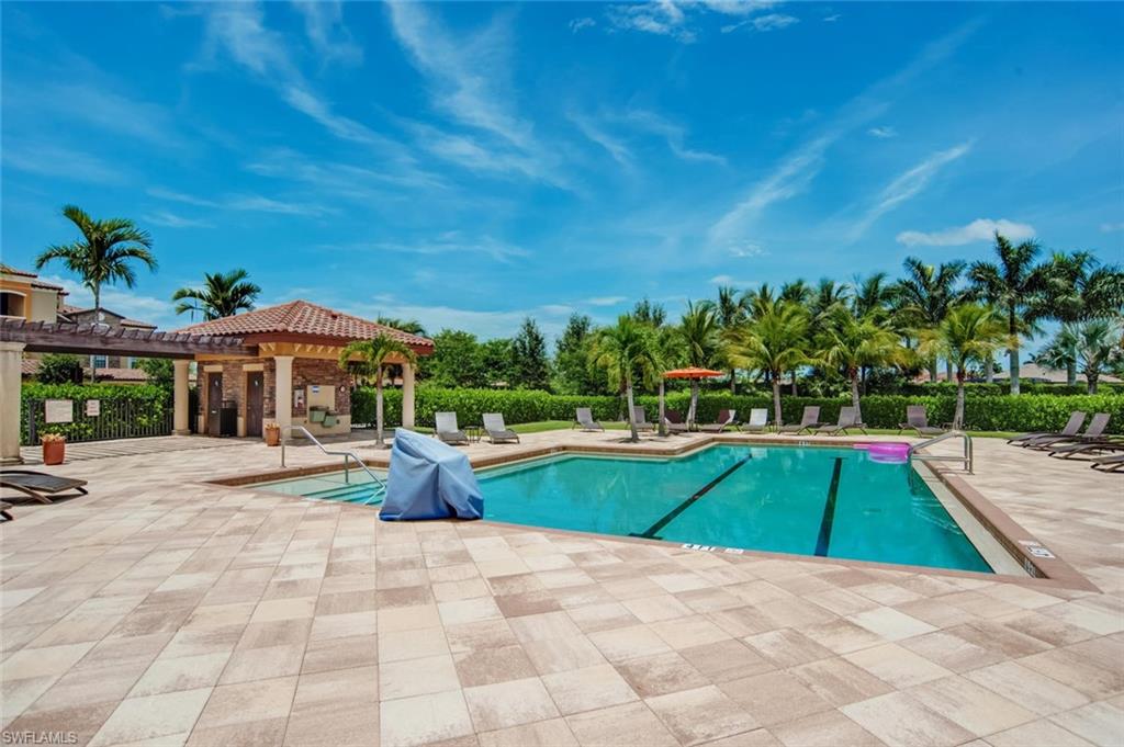 9727 Acqua Court, Unit 425 Naples, FL 34113 - Photo 18 of 26 a view of swimming pool with lounge chair