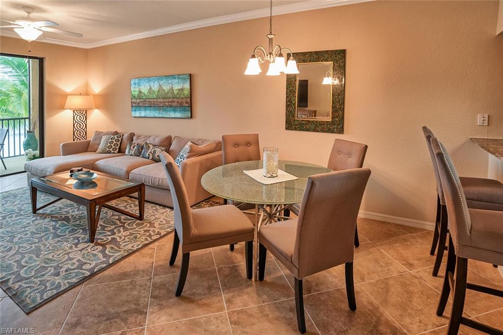 9727 Acqua Court, Unit 425 Naples, FL 34113 - Photo 5 of 26 a dining room with furniture and window