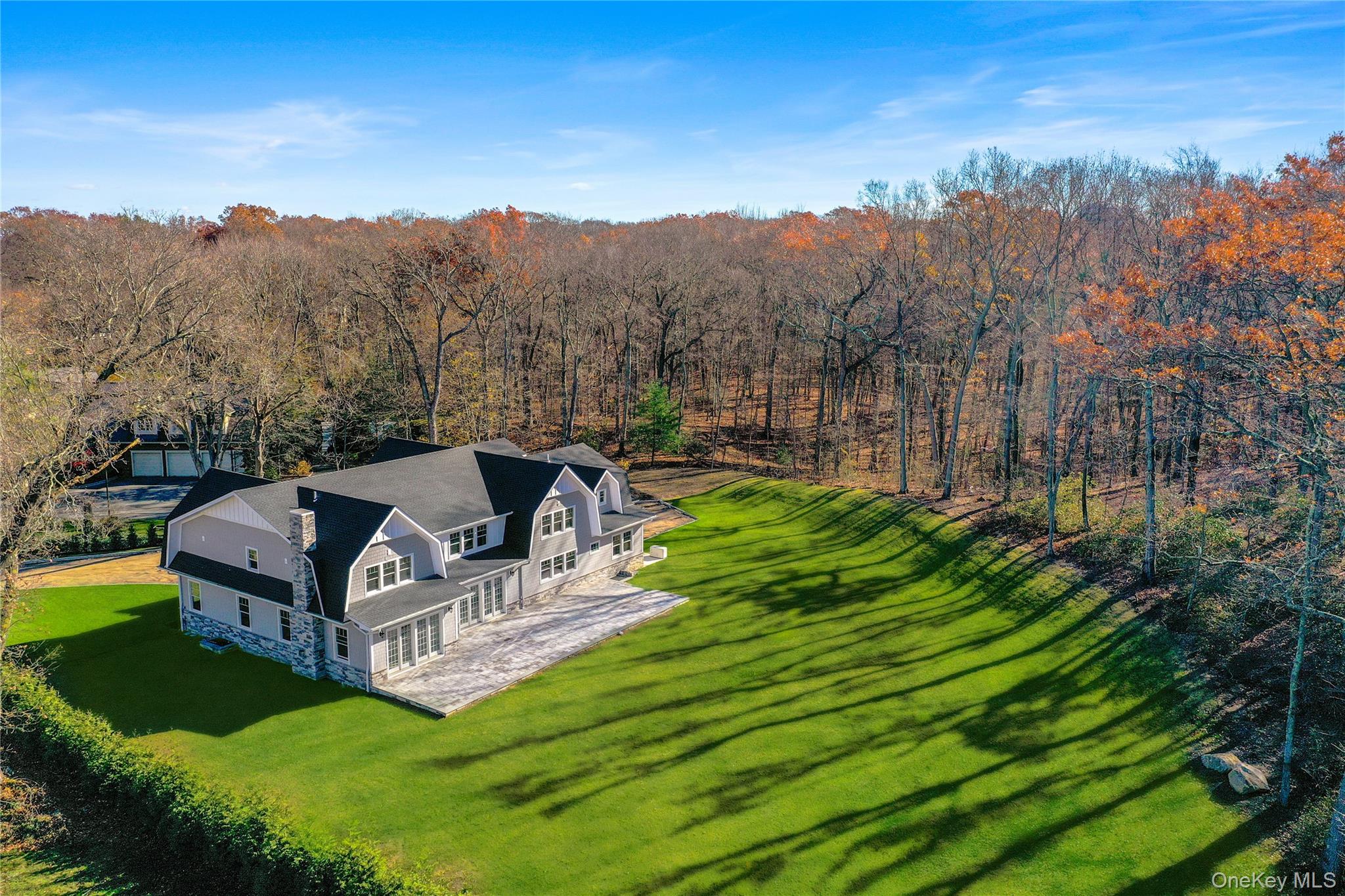 541 Split Rock Road Syosset, NY 11791 - Photo 3 of 10 a view of a garden with a house in the background