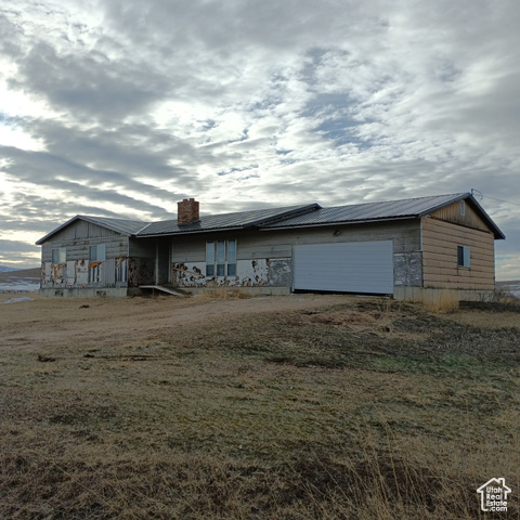 View of front of property featuring a garage