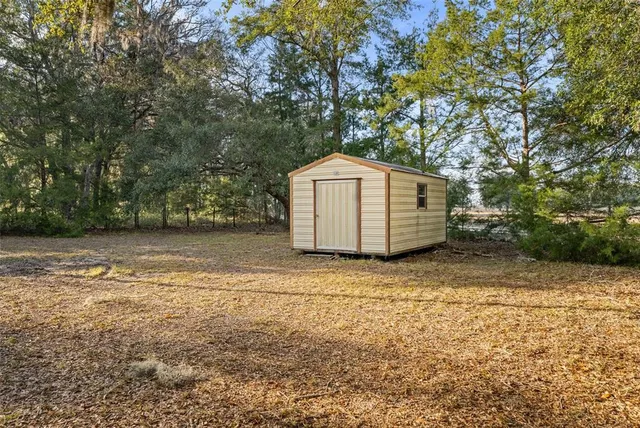 a backyard of a house with lots of green space