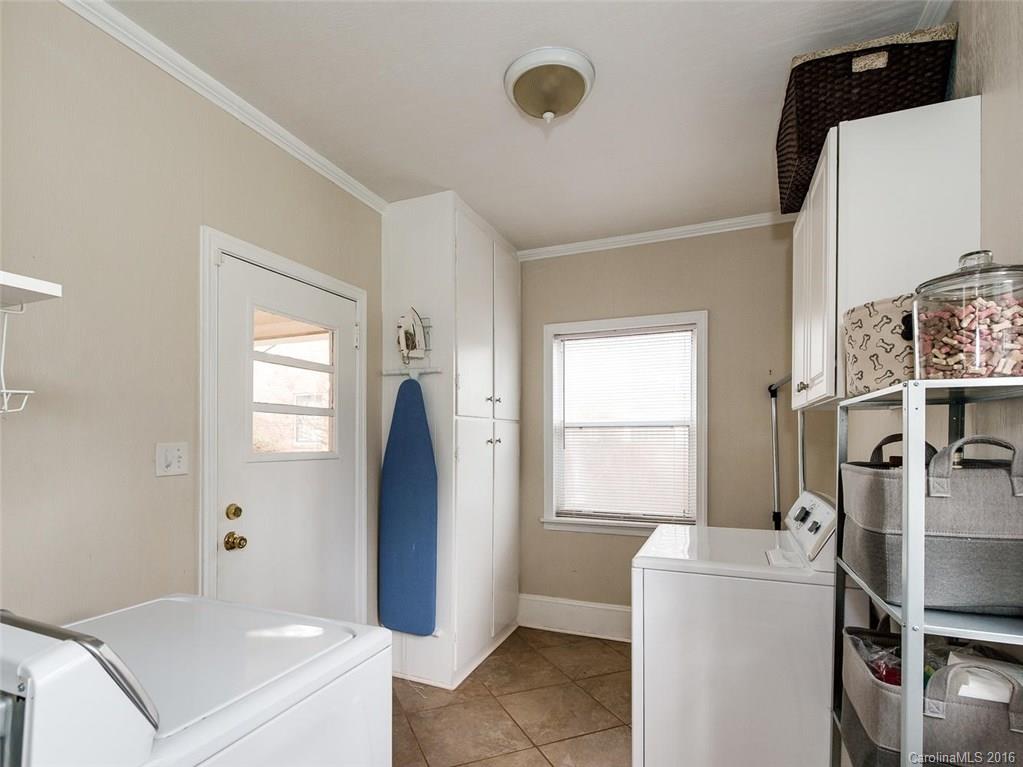 935 Scaleybark Road Charlotte, NC 28209 - Photo 15 of 17 a bathroom with a sink and a mirror
