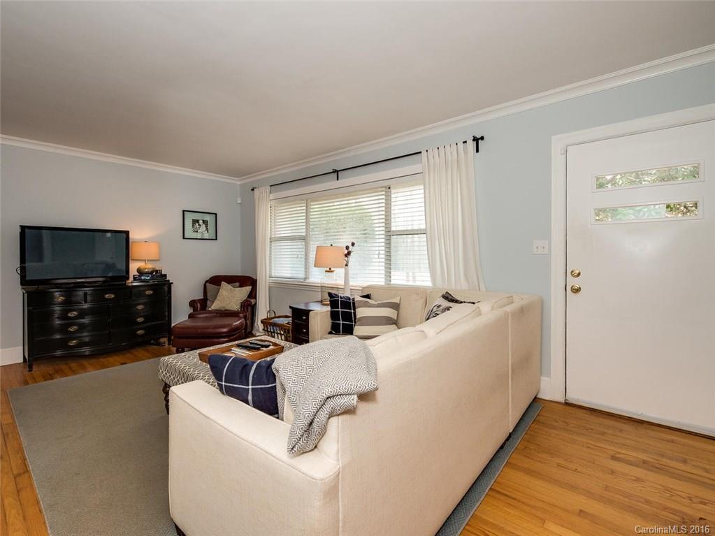 935 Scaleybark Road Charlotte, NC 28209 - Photo 3 of 17 a living room with furniture and a flat screen tv