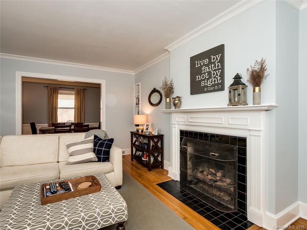 935 Scaleybark Road Charlotte, NC 28209 - Photo 4 of 17 a living room with furniture and a fireplace