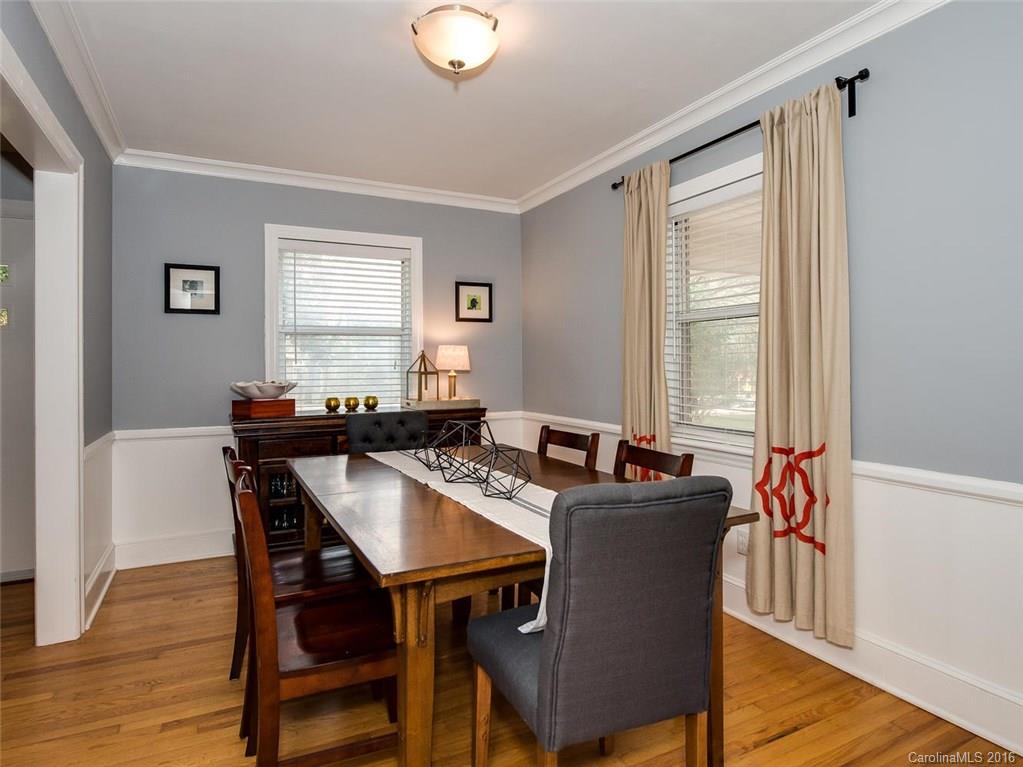 935 Scaleybark Road Charlotte, NC 28209 - Photo 5 of 17 a view of a dining room with furniture and wooden floor