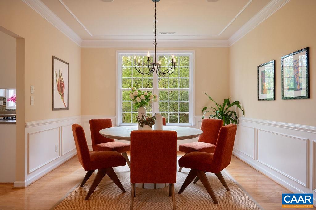 1254 Loring Run Charlottesville, VA 22901 - Photo 9 of 44 a dining room with furniture a chandelier and wooden floor
