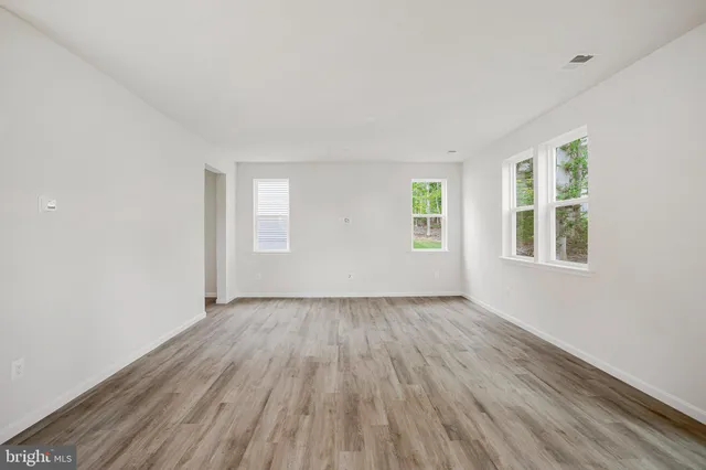 a view of kitchen with wooden floor and window