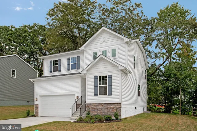 a front view of a house with garage