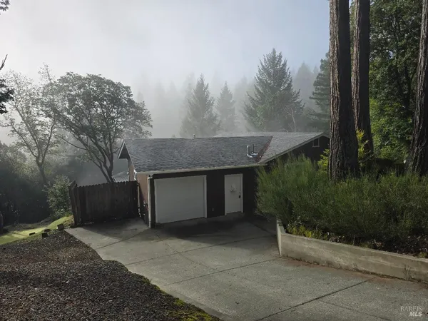 a backyard of a house with lots of green space