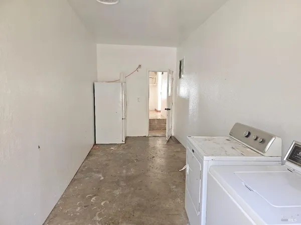a view of a storage & utility room with a sink