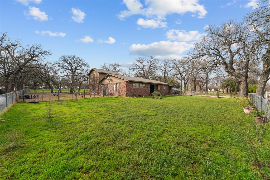 1051 Lynch Bend Road Springtown, TX 76082 - Photo 31 of 39 a house view with garden space