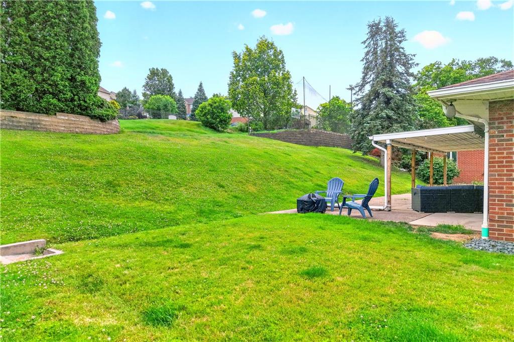 1642 Rostraver Road Belle Vernon, PA 15012 - Photo 27 of 32 a view of a chair and table on the green field