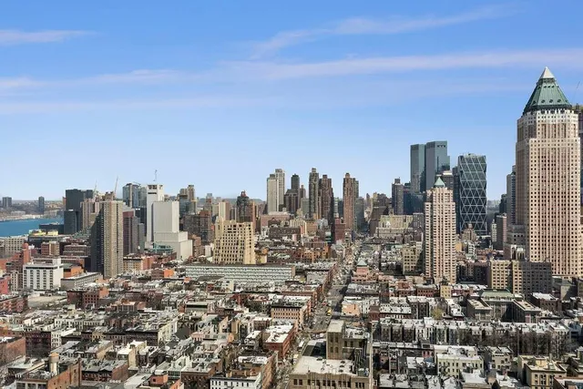a view of a city with tall buildings in the background