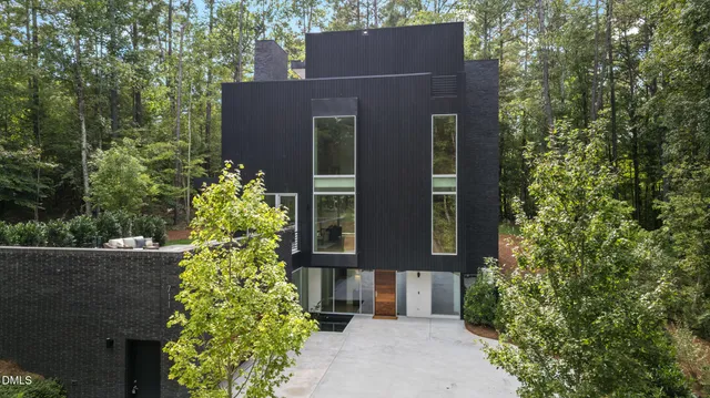 a hallway with a couch and wooden floor
