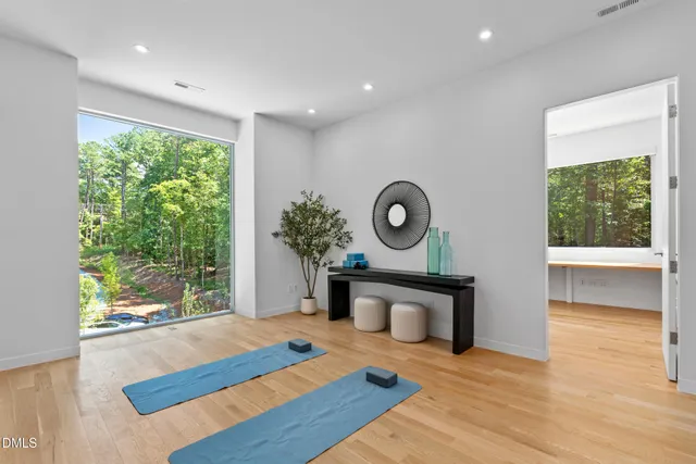 a living room with furniture and painting on the wall